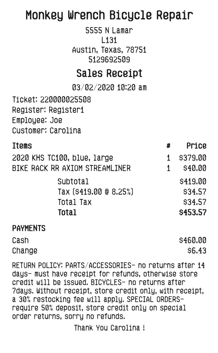 Sample bike shop sales receipt with two items, tax, cash, change, and a return policy.